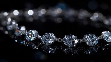Sparkling diamond necklace with brilliant cut on black background reflecting light photo