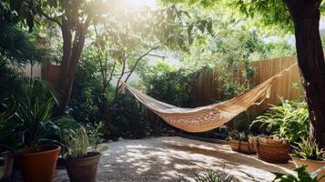 Tranquil backyard hammock among lush greenery in sunlit garden photo