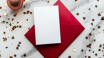White christmas card resting on red envelope, sprinkled with golden confetti, elegant marble background creating festive holiday scene photo