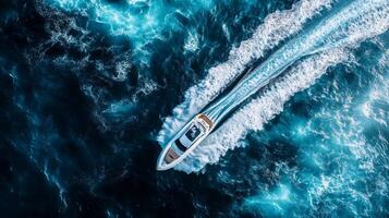 Aerial view of speedboat cruising through blue ocean waters photo