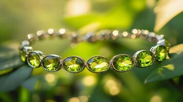 Elegant green gemstone bracelet on lush greenery background photo