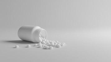 Spilled white pills from bottle on minimalist light gray background photo