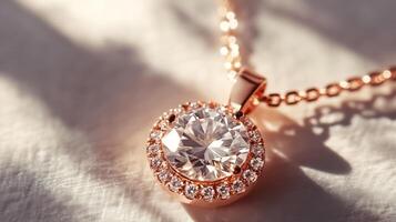 Elegant rose gold diamond pendant on chain with soft shadows and textured background photo