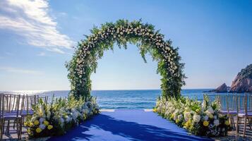 Stunning beach wedding ceremony with floral arch and ocean view photo