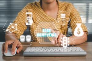 Edge computing concept, Person using computer on office desk with Edge computing icon on virtual screen, modern IT technology, internet and networking concept. photo