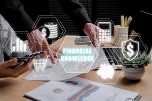 Financial knowledge concept, Business team analyzing income charts and graphs with financial knowledge icon on virtual screen. photo