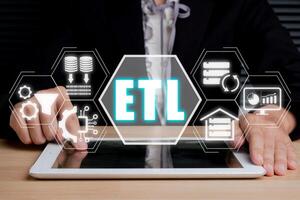ETL extract transform load concept, Person using digital tablet with extract transform load icon on virtual screen. photo