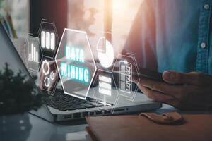Data mining banner web icon for business and organization, Businessman working on laptop computer with data mining icon on VR screen. photo