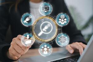 Visual representation of search engine marketing with digital icons and a business professional using a laptop. photo