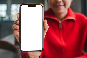 Close-up of a woman displaying a smartphone with a blank screen, ideal for showcasing apps or digital content. photo