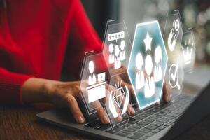 Visual representation of employer branding with digital icons and a professional using a laptop, symbolizing modern workplace strategies. photo
