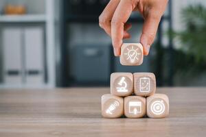Creative depiction of content strategy using wooden blocks with digital icons, symbolizing modern business planning and innovation. photo