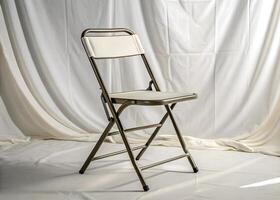 A white folding chair with a white cloth covering it photo