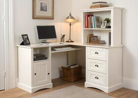 A white computer desk with drawers and a lamp photo
