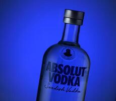 Gaziveren Cyprus -04.03.2025 Unique bottle illuminated in blue highlighting a sleek design and vibrant color for an artistic vibe photo