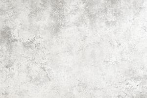 Textured gray background with subtle variations in tone for artistic design projects. photo