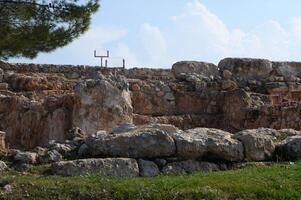 Historical ruins under a bright sky highlighting ancient stone structures and the passing of time photo