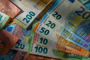 Currency collection showcasing various Euro denominations in vibrant colors and details on a flat surface photo