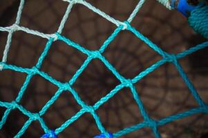 Colorful woven net creating intriguing patterns in soft light photo