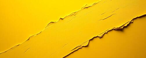 Thick yellow paint is creating a textured diagonal stripe on a yellow background photo