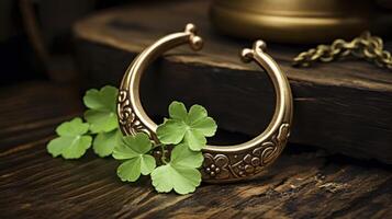 A gold bracelet with a leaf design on it photo
