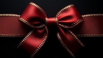 large red ribbon with golden edges, tied in an elegant bow photo