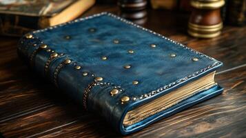 A blue leather book with gold rivets on it photo