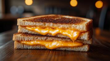 A grilled cheese sandwich with melted cheese on top photo