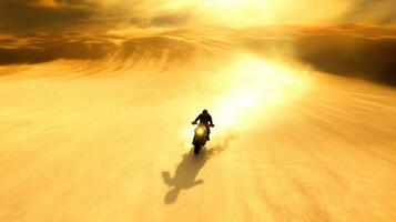 A motorcyclist races through a vast desert landscape under a golden sky, creating a sense of freedom and adventure. photo
