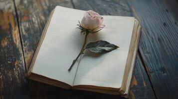 emocional valor concepto. un cerrado libro descansa en un de madera superficie, adornado con un delicado rosado rosa, simbolizando belleza y nostalgia. foto