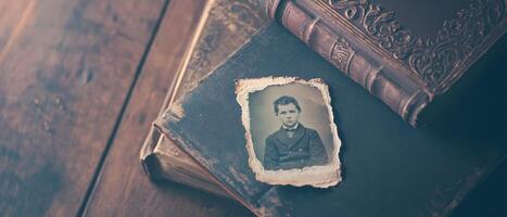 Emotional Value Concept. A vintage photograph of a man placed on antique books, highlighting nostalgia and historical context. photo