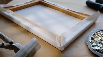 Canvas print. Process of stretching canvas on stretcher frame. Tools and accessories. photo