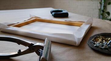 Canvas framing. Tools and accessories for stretching canvas on stretcher frame. photo
