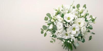 Elegant white floral bouquet featuring roses and greenery arranged for a special occasion photo