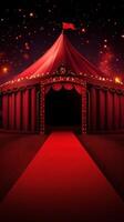 Grand red circus tent illuminated by lights in a festive atmosphere at night photo