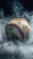 Baseball resting in a mysterious fog with a weathered surface showcasing signs of use and age photo