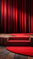 Steps leading up to a red carpet in front of rich red curtains, perfect for a grand event or performance photo