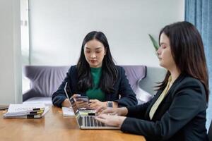 Team of professionals collaborating on financial analysis and strategy planning in a modern office setting. photo