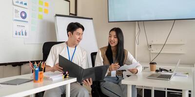 Team members collaborating on financial strategies and sharing insights photo