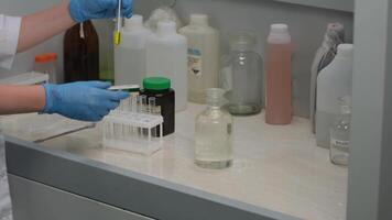 Scientist Handling Test Tubes in Laboratory Experiment video