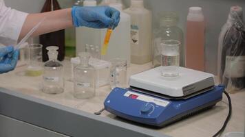 Scientist Observing Reaction in Flask video