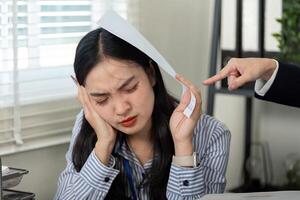 Stressed professional woman overwhelmed by work, dealing with financial challenges. photo