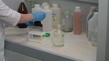 Scientist Handling Test Tubes in Laboratory Experiment video