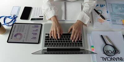 Professional accountant preparing financial reports and analyzing budget data at a modern workspace. photo