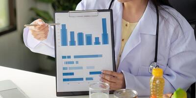 Nutrition analysis. A dietitian explaining data on food consumption during a virtual session. photo