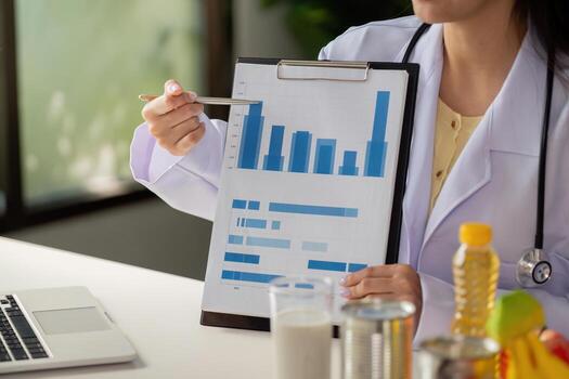 Nutrition report presentation. Nutritionist presenting health data on charts and graphs. photo