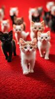 Cute kittens playfully walking on a vibrant red carpet during a sunny afternoon in a cozy indoor space photo