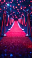 Glamorous red carpet leading to a dazzling entrance at a nighttime event with vibrant lights photo