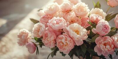 Beautiful bouquet of fresh pink peonies arranged artistically in natural light for an elegant display photo