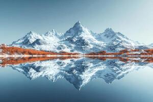 Snowy mountain range reflecting on a lake with orange trees photo